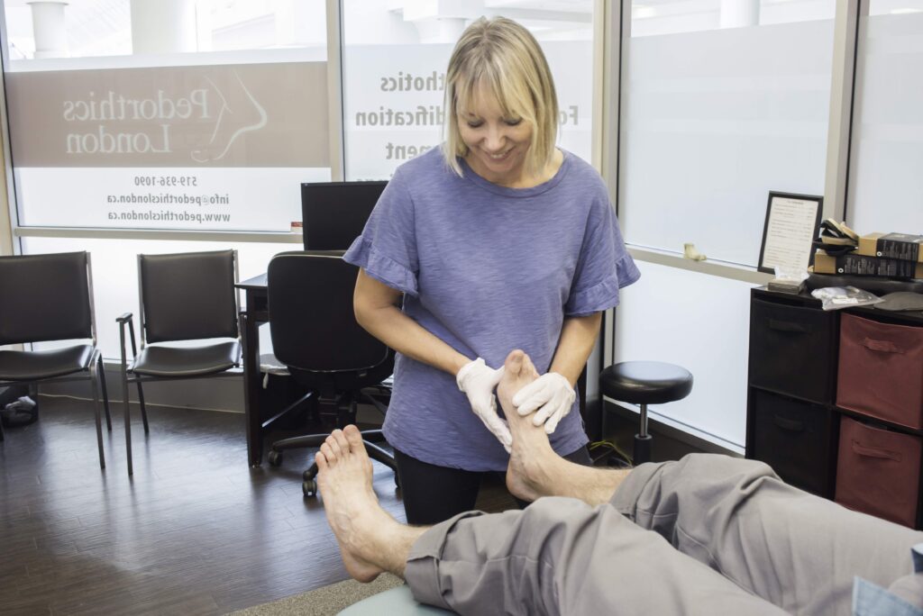 Judy Flegel assessing foot
